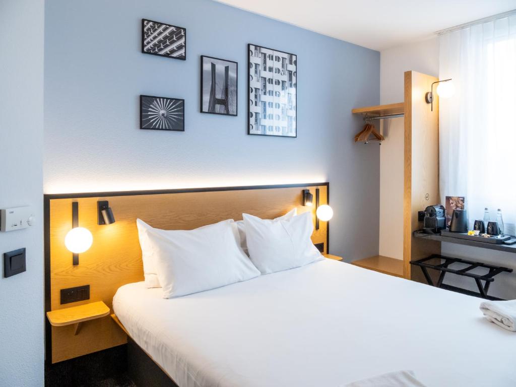 Postel nebo postele na pokoji v ubytování B&B HOTEL Wrocław Centrum