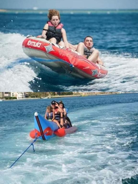 a group of people riding on a raft in the water at Al-Dora Resort Hurghada in Hurghada