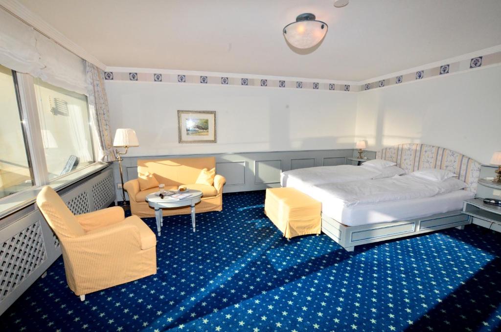 Postel nebo postele na pokoji v ubytování Hotel Wiking Sylt