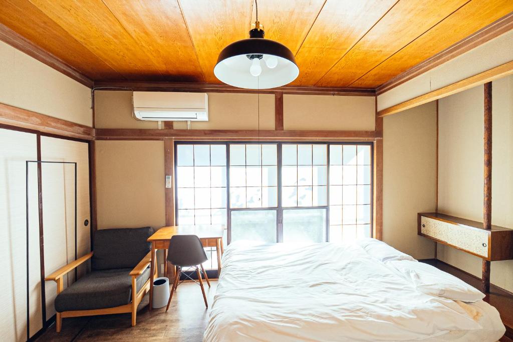 Postel nebo postele na pokoji v ubytování yururito guesthouse
