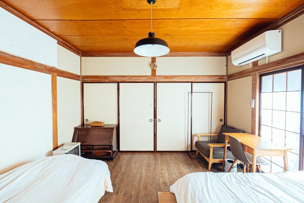 Postel nebo postele na pokoji v ubytování yururito guesthouse