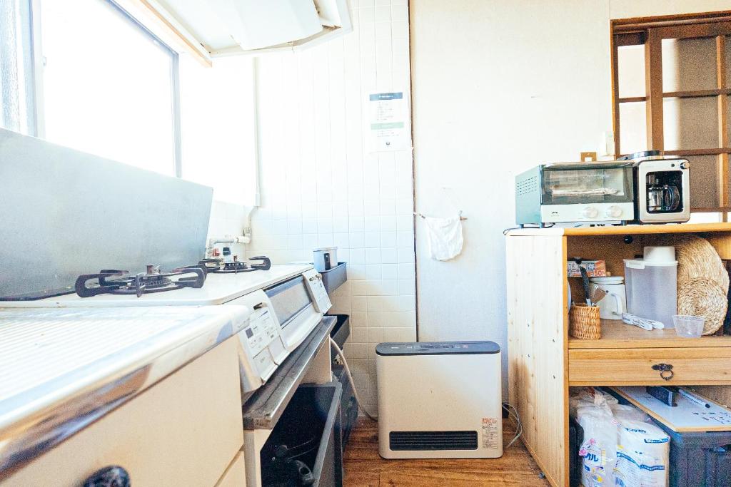Kuchyň nebo kuchyňský kout v ubytování yururito guesthouse