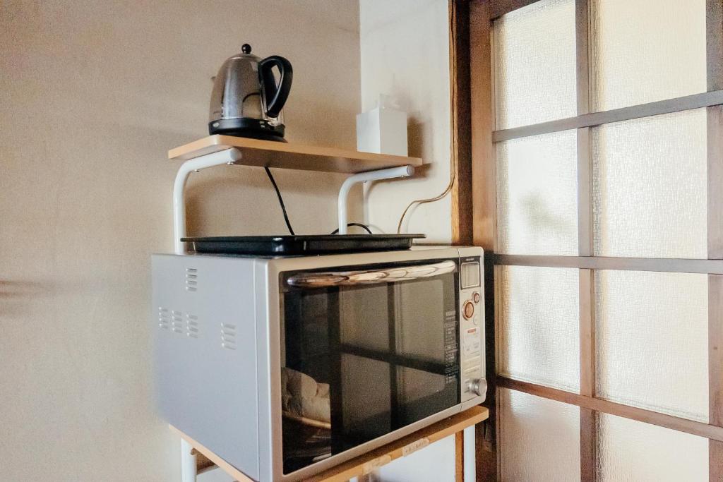 Kuchyň nebo kuchyňský kout v ubytování yururito guesthouse
