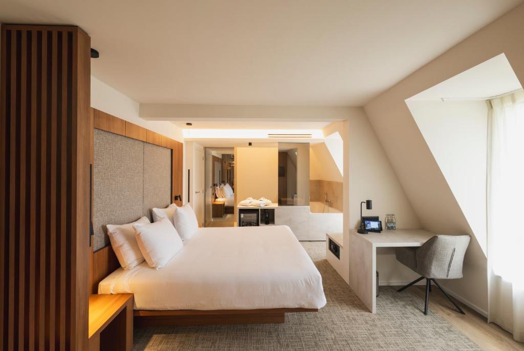 Postel nebo postele na pokoji v ubytování Begijnhof Hotel