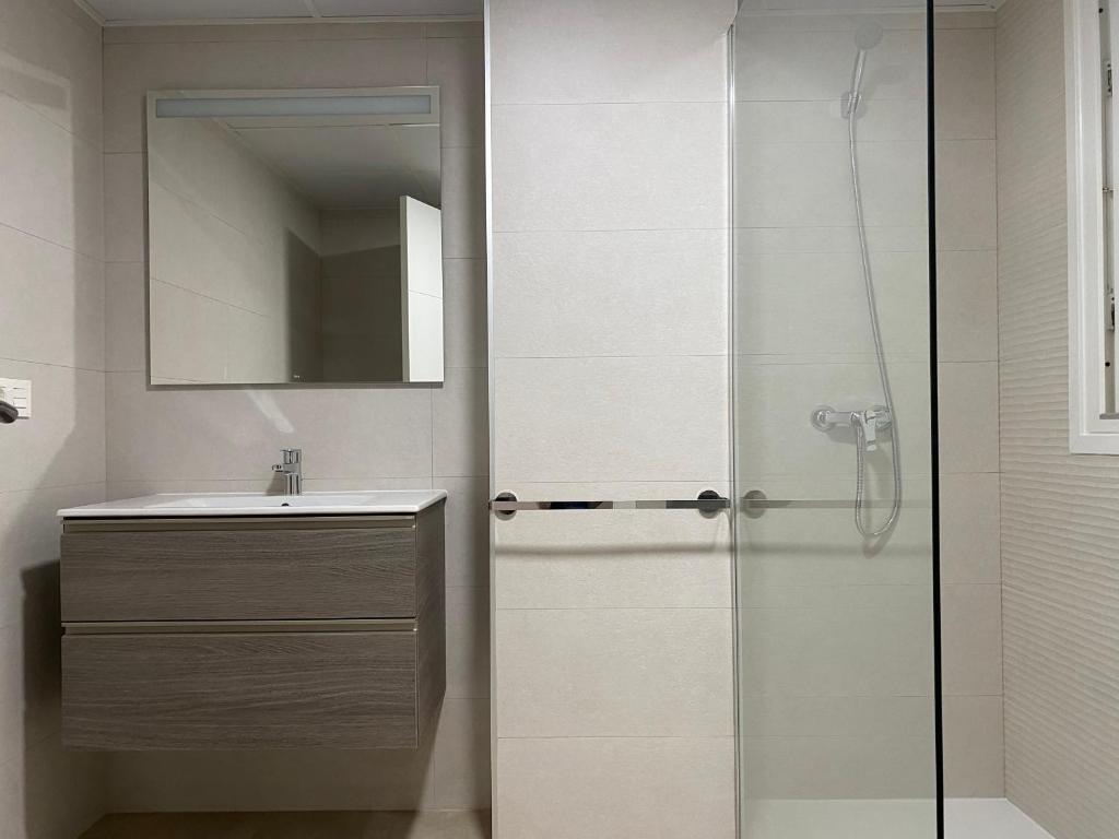 a bathroom with a shower and a sink at Apartahotel Vistamar San José in San José