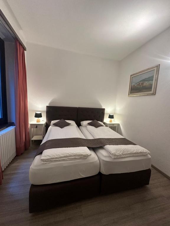 Postel nebo postele na pokoji v ubytování Hotel Croce Federale