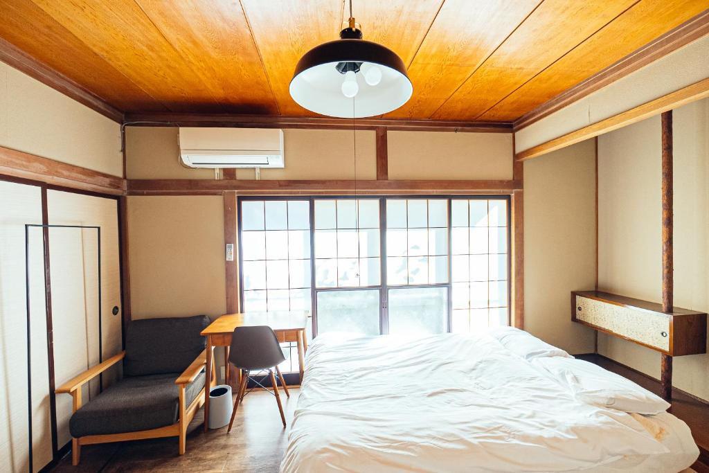 Postel nebo postele na pokoji v ubytování yururito guesthouse