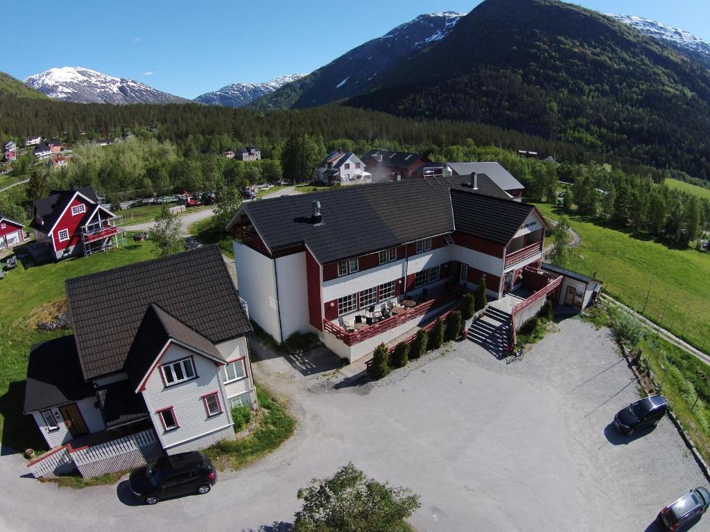 an aerial view of a large house in the mountains at Jostedal Hotel in Jostedal