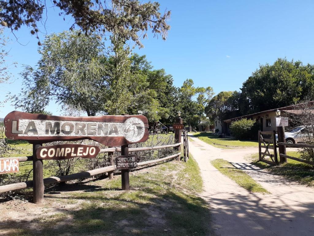 a sign for la morgan comedia on a road at Complejo La Morena in Mina Clavero