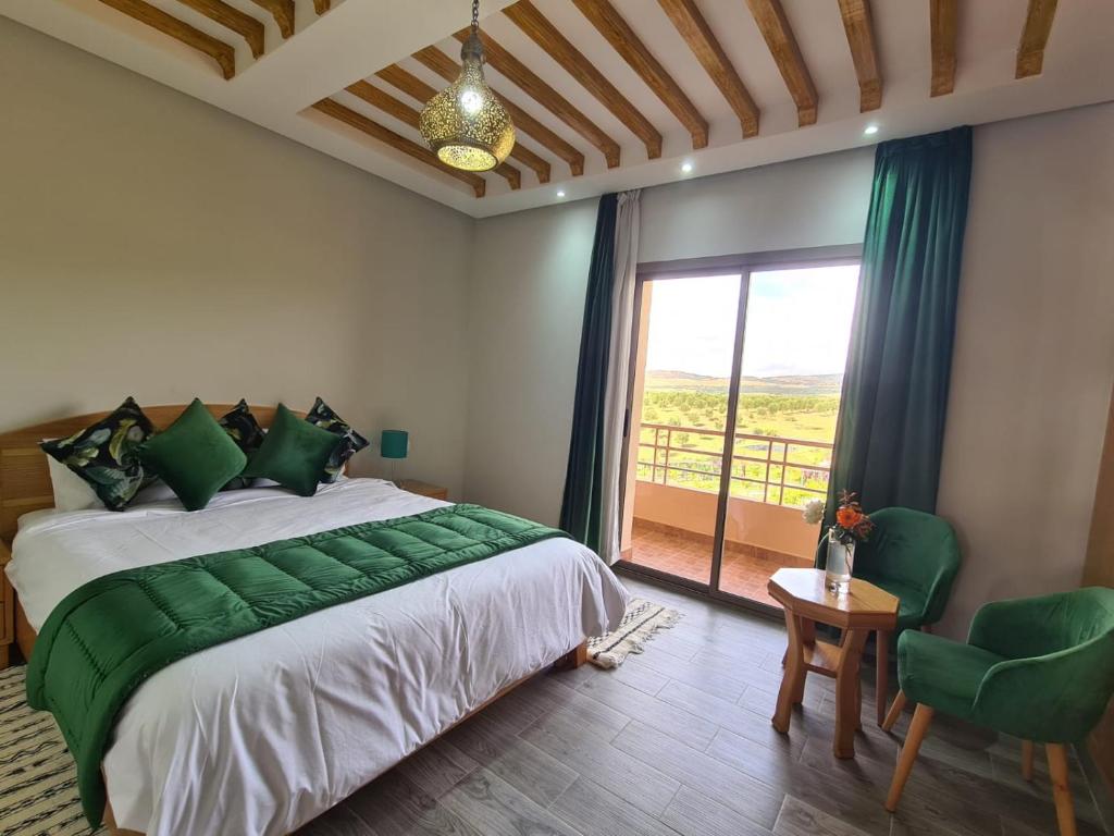 Postel nebo postele na pokoji v ubytování Ferme d'hôtes Bladna Garden