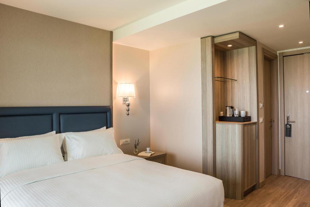Postel nebo postele na pokoji v ubytování Electra Kefalonia Hotel & Spa