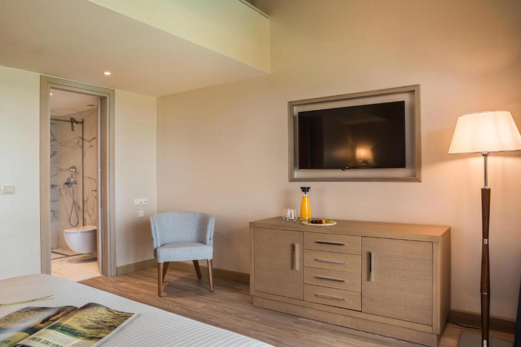 Postel nebo postele na pokoji v ubytování Electra Kefalonia Hotel & Spa