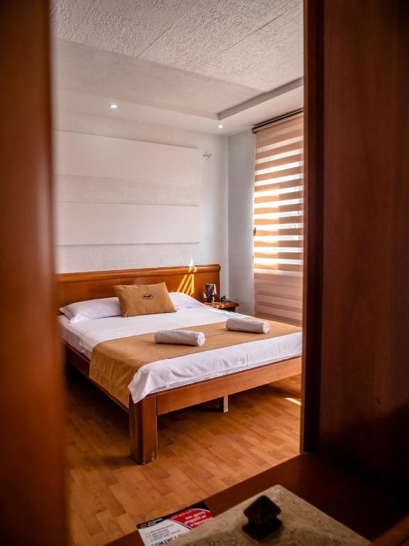 Postel nebo postele na pokoji v ubytování Apartments Bonita