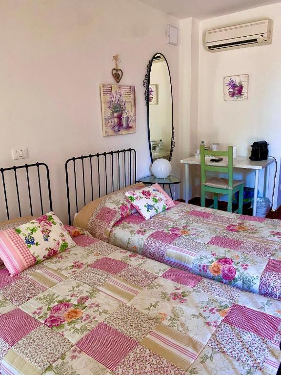 Postel nebo postele na pokoji v ubytování Ca' Borgo delle Rane