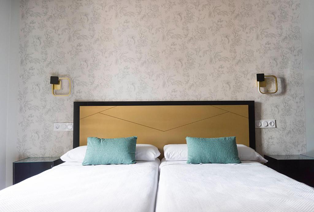 Postel nebo postele na pokoji v ubytování Hotel Juancaballo