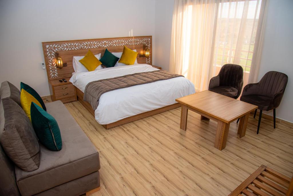 Postel nebo postele na pokoji v ubytování Ferme d'hôtes Bladna Garden