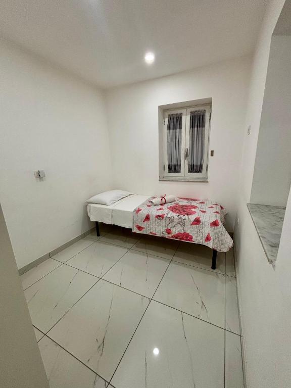 Łóżko lub łóżka w pokoju w obiekcie B&B Aria di Sole