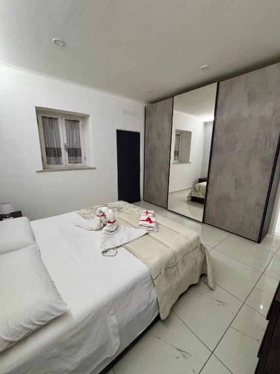 Łóżko lub łóżka w pokoju w obiekcie B&B Aria di Sole