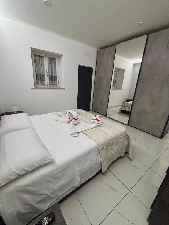 Łóżko lub łóżka w pokoju w obiekcie B&B Aria di Sole