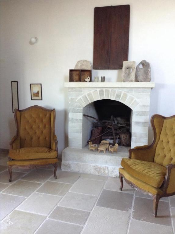 Posezení v ubytování Trulli e Masseria Ianella