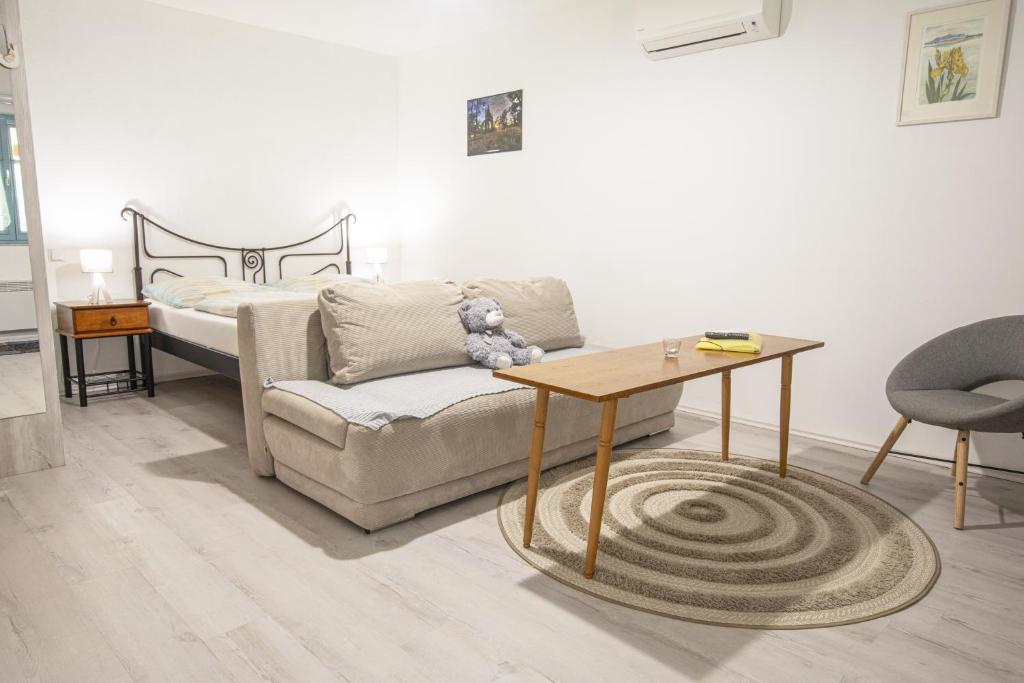 Postel nebo postele na pokoji v ubytování Apartmány Uprostřed zeleně