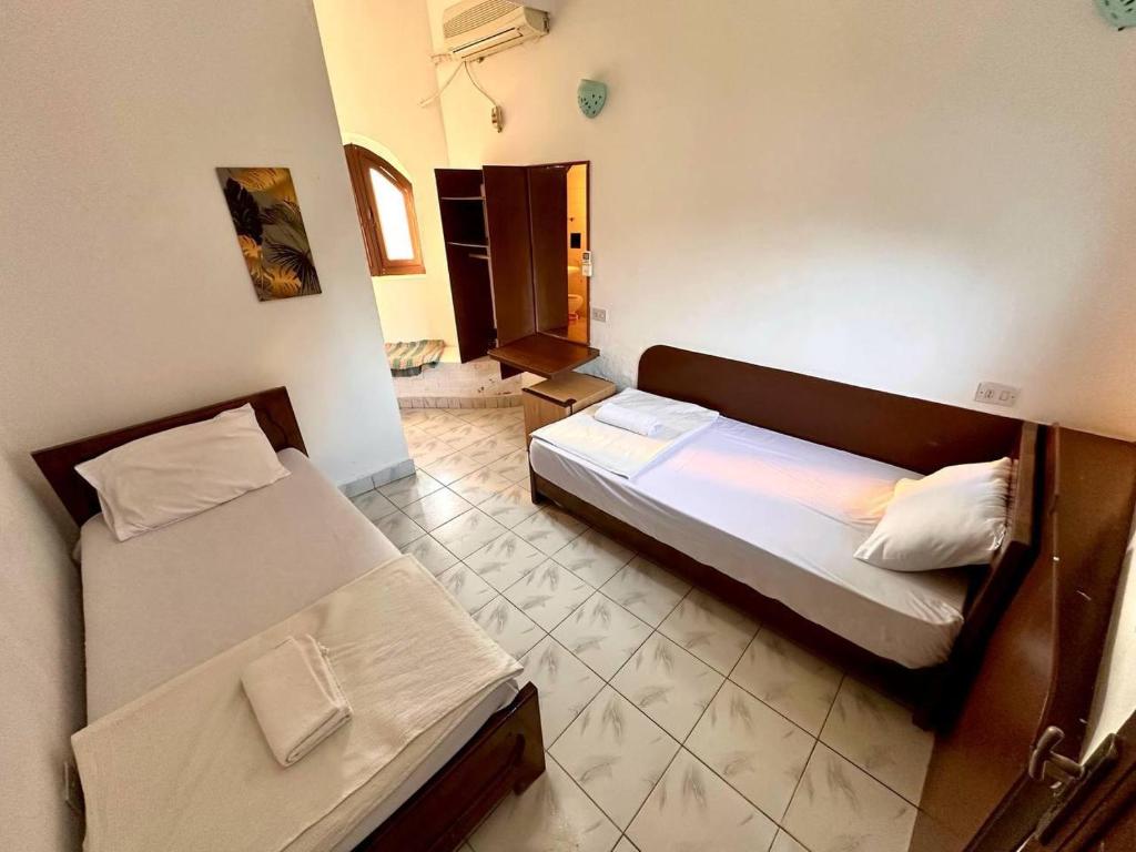 Postel nebo postele na pokoji v ubytování Amanda beach hotel