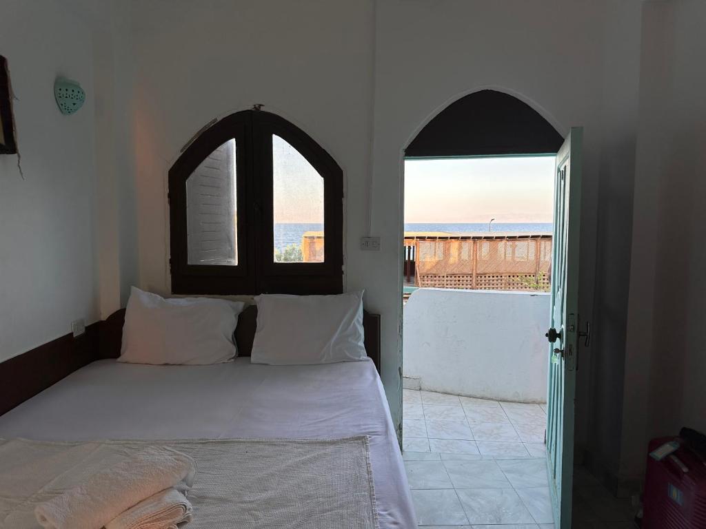 Postel nebo postele na pokoji v ubytování Amanda beach hotel