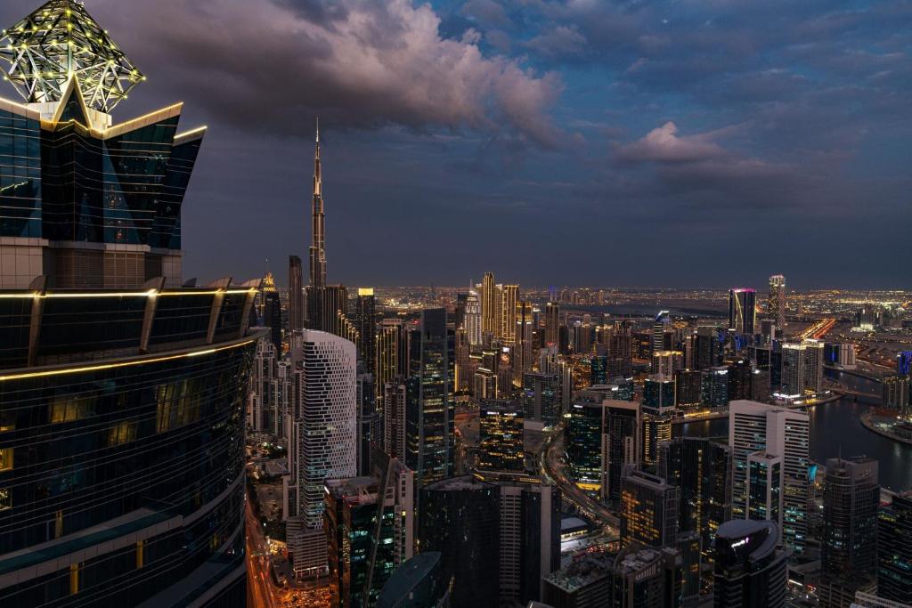 a view of a large city at night at JW Marriott Marquis Hotel Dubai in Dubai