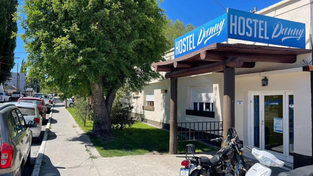 a motorcycle parked in front of a hotel music room at Hostel Danny in El Calafate