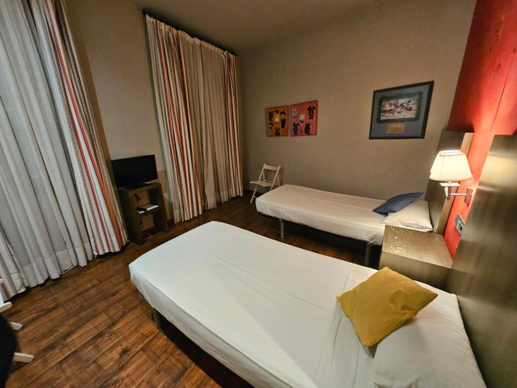 Postel nebo postele na pokoji v ubytování Hotel Annex - Rey Don Jaime I