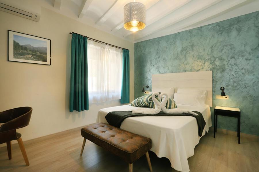 Postel nebo postele na pokoji v ubytování Nasilvana Hotel & Spa Adults Only