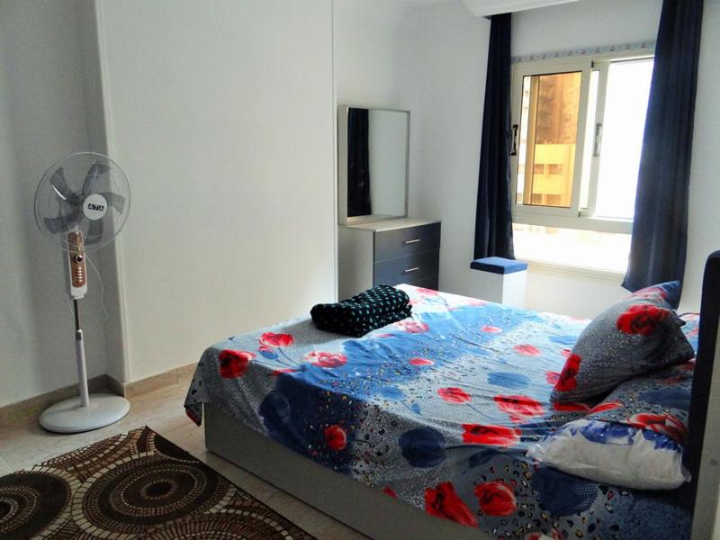 Postel nebo postele na pokoji v ubytování شقق موفينبيك هاوس 3