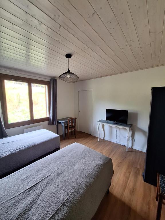 Postel nebo postele na pokoji v ubytování La Villa des Sources