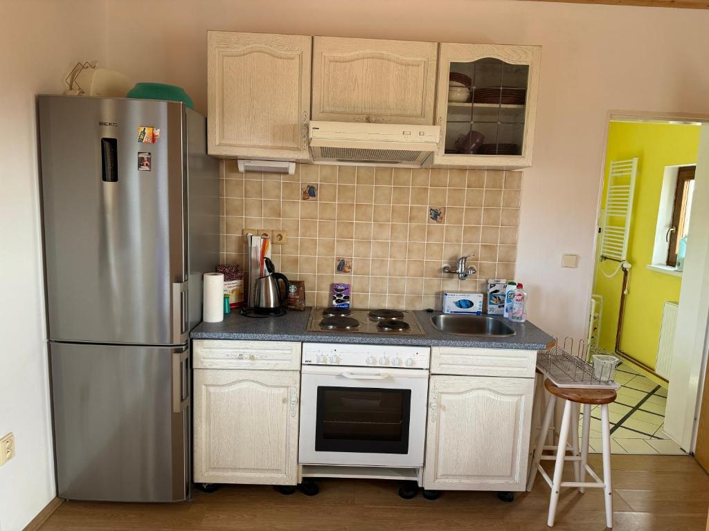 Kuchyň nebo kuchyňský kout v ubytování L&B Home