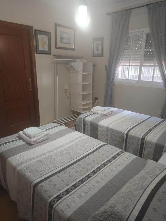 Postel nebo postele na pokoji v ubytování Dunas villa