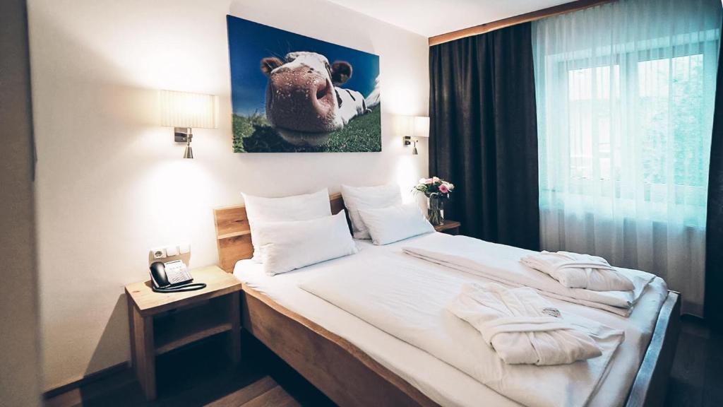 Postel nebo postele na pokoji v ubytování Aktivhotel Wildschütz