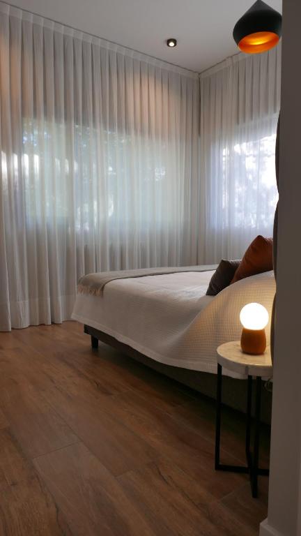 Postel nebo postele na pokoji v ubytování Huli B&B