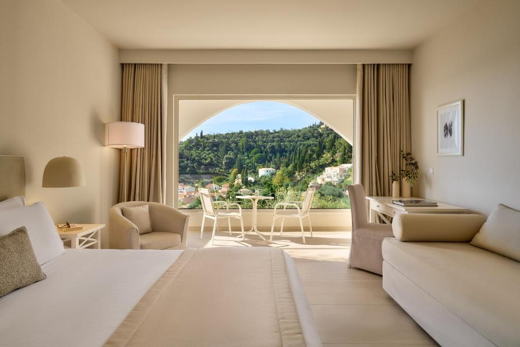 Postel nebo postele na pokoji v ubytování San Antonio Corfu Resort (Adults Only)