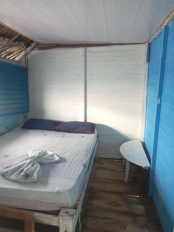 Voodi või voodid majutusasutuse Hostal Playa Blanca toas