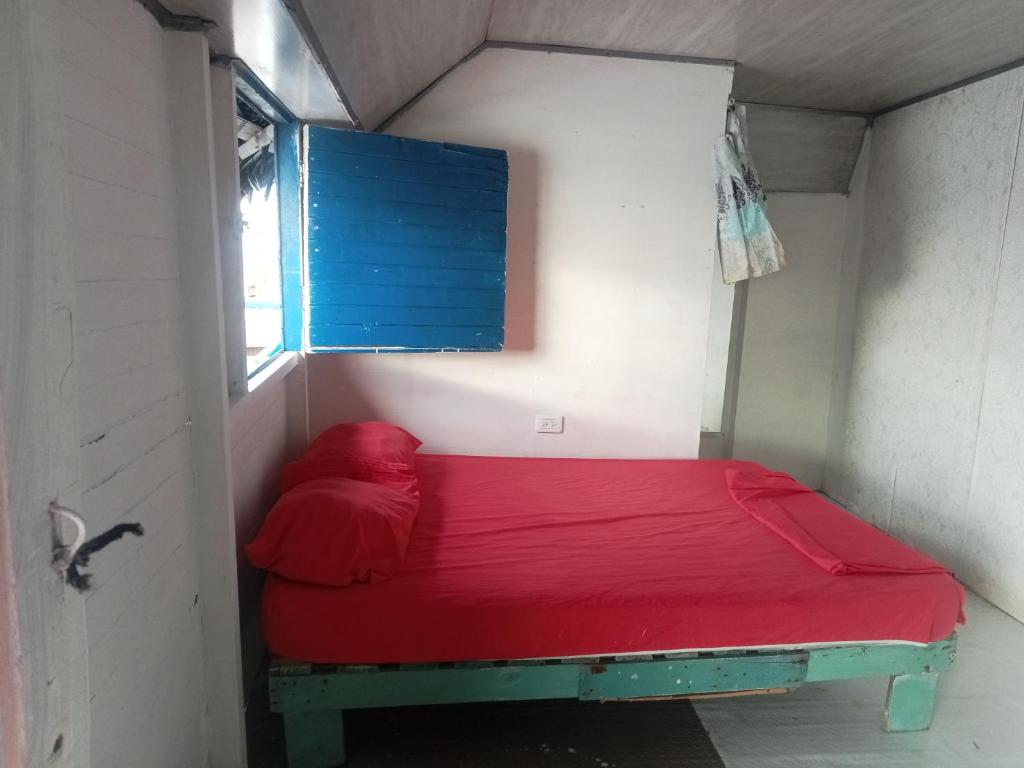 Voodi või voodid majutusasutuse Hostal Playa Blanca toas