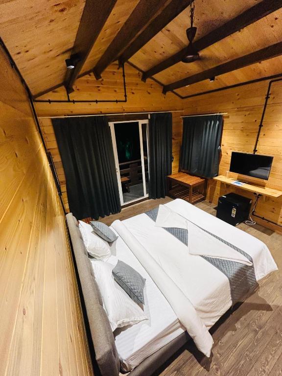 Postel nebo postele na pokoji v ubytování Seclude Eco Cottages