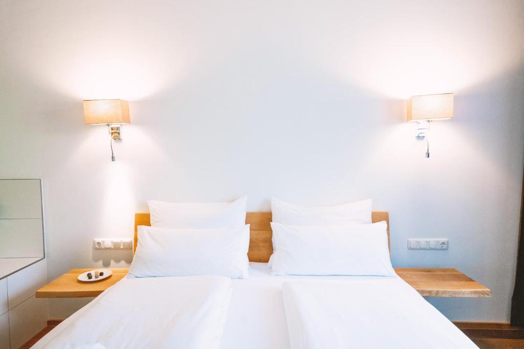 Postel nebo postele na pokoji v ubytování Aktivhotel Wildschütz