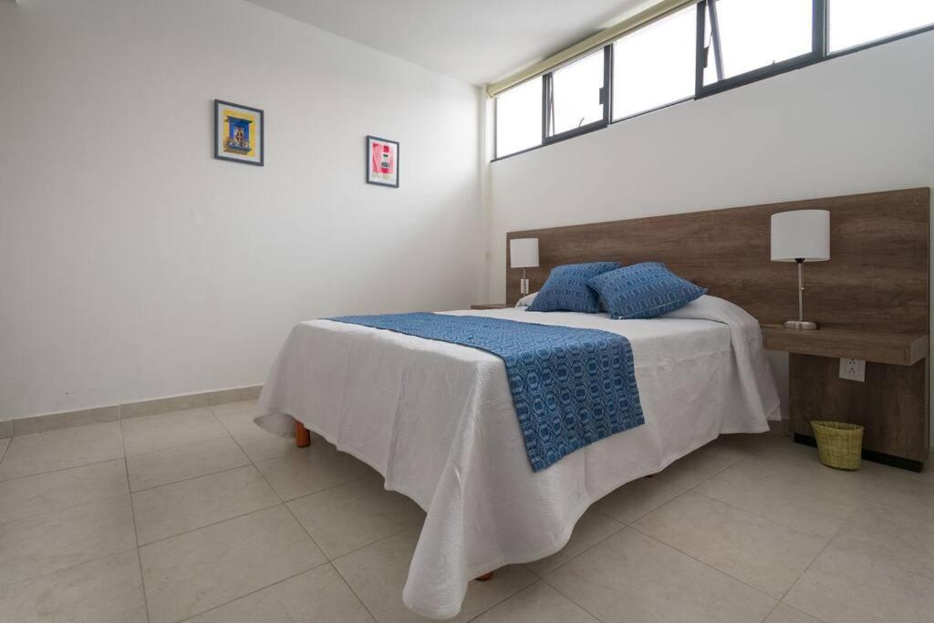 Giường trong phòng chung tại R4 Oaxaca Experience