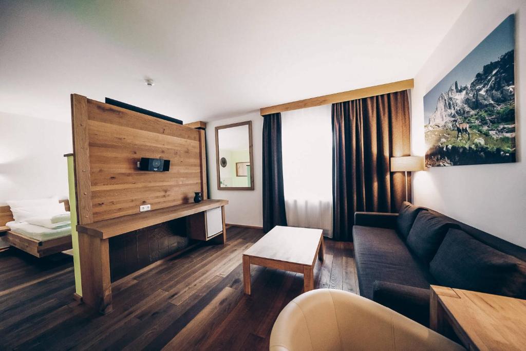 Postel nebo postele na pokoji v ubytování Aktivhotel Wildschütz