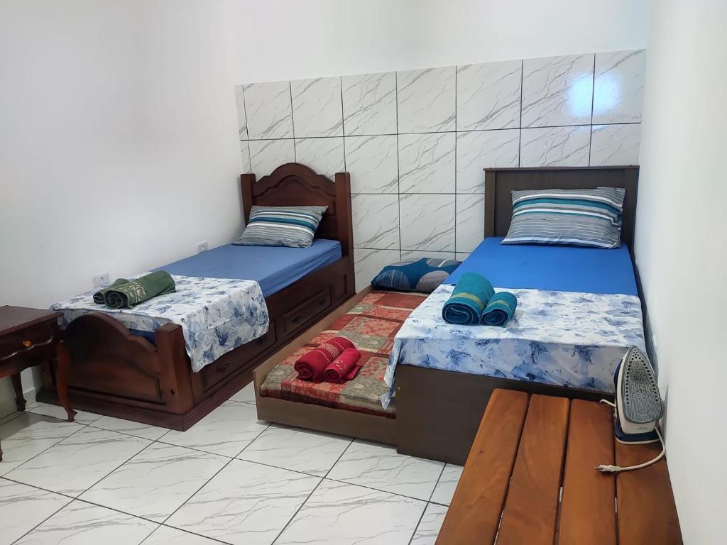 Ένα ή περισσότερα κρεβάτια σε δωμάτιο στο Aconchego da dona Dulce