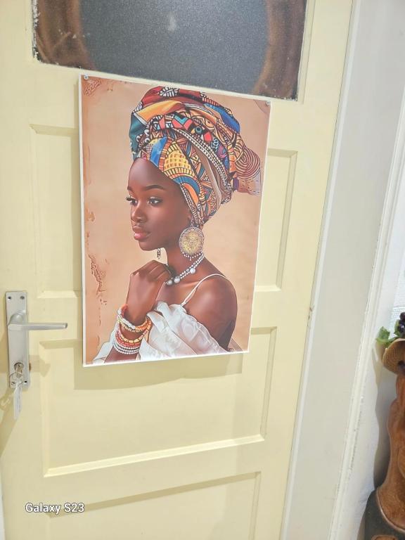 a picture of a woman on a door at Tropical Room in Brussels