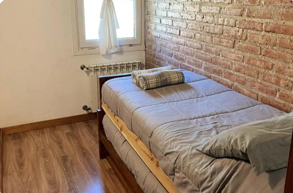 Кровать или кровати в номере La Pampita en Villa Arelaquen Casa M14