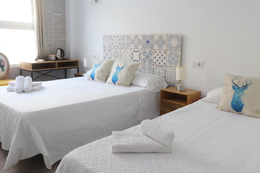 Postel nebo postele na pokoji v ubytování Hotel CALPE