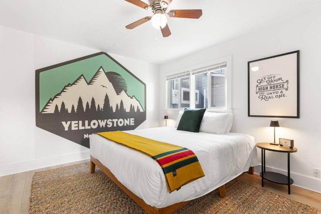 a bedroom with a bed and a ceiling fan at Hot Tub 4 Baths 4 Bedrooms Montana Themed Bikes in Livingston