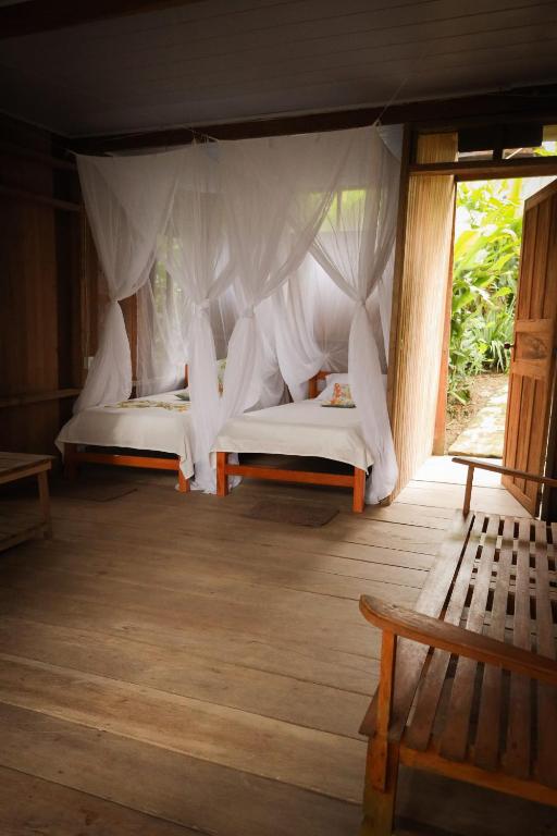 Postel nebo postele na pokoji v ubytování La Ceiba, Amazonas